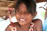 Smiling young saleswoman, Skun, Cambodia.