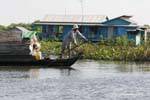 Gesture of the rower, Tonle Sap Lake, Cambodia.