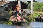 Children to maneuver, Tonle Sap Lake, Cambodia.