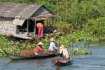 Exchange on the lake, Tonle Sap, Cambodia.