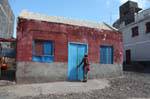 Santo Antão, Ponto do Sol, woman and colorful hut, Cape Verde.
