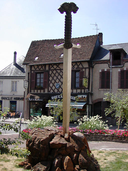 Sword planted in a rock monument of Auld Alliance Aubigny-sur-Nere, France.