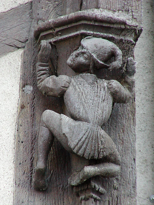Detail of a wooden sculpture on the house Acrobats, Blois, France.