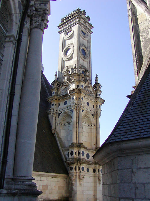 Decorations and slate fireplace around, Château de Chambord, France.