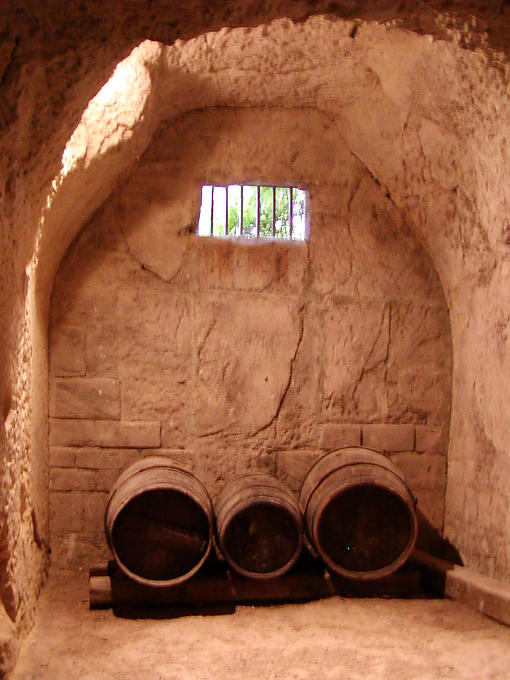 Barrels in the cellar dug into the tufa, Castle of Ussé, France.