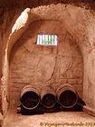 Barrels in the cellar dug into the tufa, Castle of Ussé, France.
