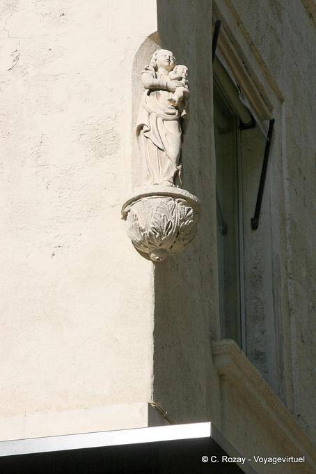 Niche with Virgin sculpture to the child in a street Avignon, Provence, France