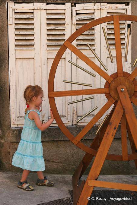 Collobrières, little girl in the musical wheel, Provence, France