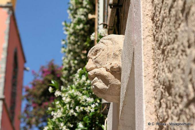 Saint-Tropez, stone head in the wall, Provence, France