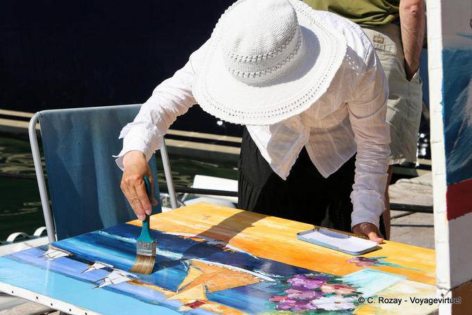 Saint-Tropez, a painter working woman, Provence, France