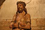 Wooden sculpture of Christ before a family tomb, Notre Dame des Doms, Avignon, France.