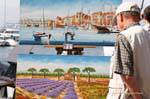 Saint-Tropez, exhibition of paintings on the port, France.