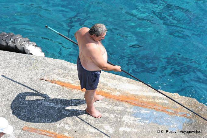 Agia Roumeli-fisherman on the pier - Crete, Greece