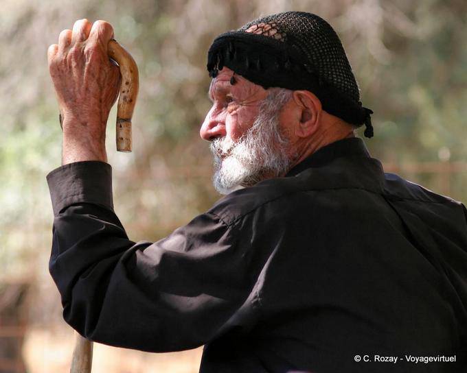 Profile of the former Anopoli with traditional shepherd's cane - Crete, Greece