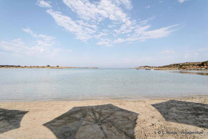 Umbrellas shadows on the sand, Elafonissi - Crete, Greece