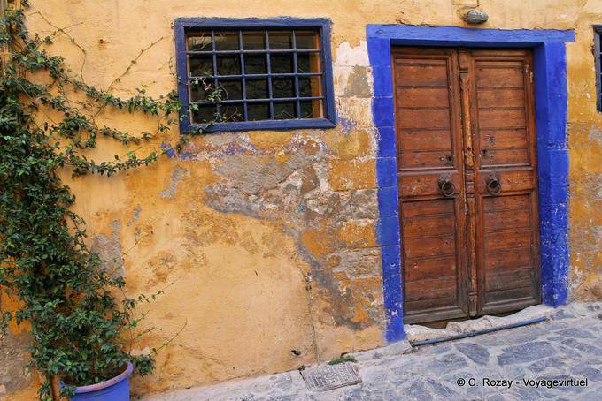 Door to blue and yellow wall, Chania - Crete, Greece