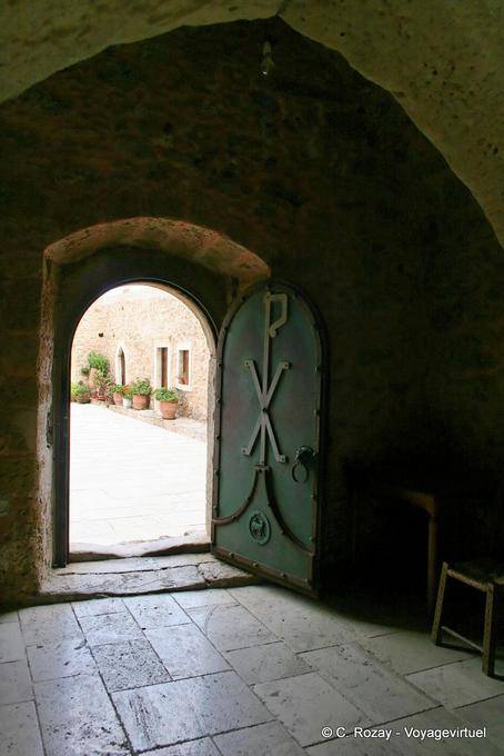 Arch and iron gate in the monastery of Toplou - Crete, Greece