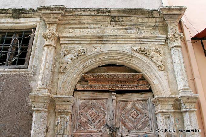 Rethymnon Street Klidi gate with decorated spandrels - Crete, Greece