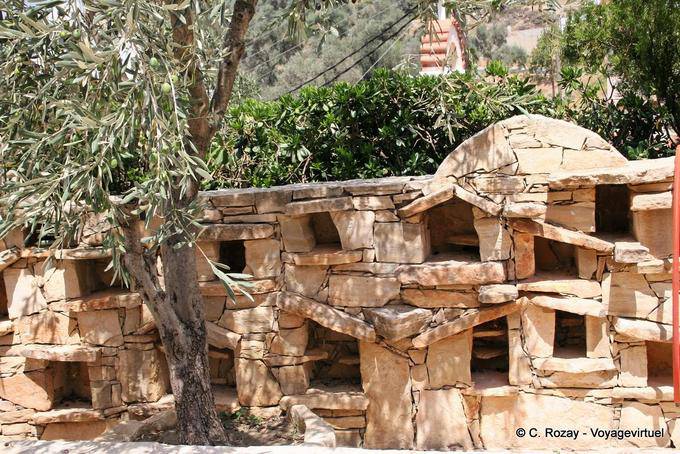 Spili renovated ancient wall, niches and flat stones - Crete, Greece