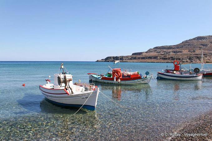 Kato Zakros, fishing boats moored on the crystal clear water - Crete, Greece