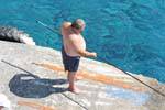 Agia Roumeli-fisherman on the pier, Crete.