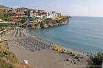 Beach orderly awaiting swimmers Mpali, Crete.