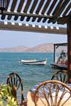 Restaurant feet in the water, Elounda, Crete.