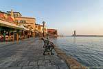 Calm of the morning with no one on the port of Chania, Crete.