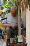 Rethymnon, tailor working in the street, Crete.