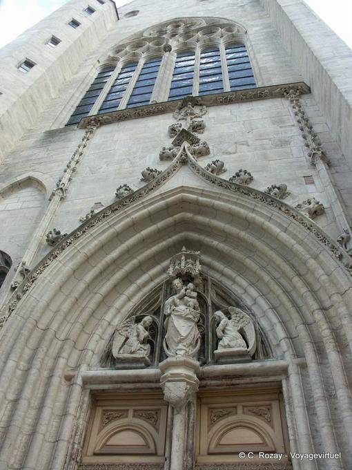 Angels and virgin sculpted on the portico of the church of Notre Dame, Dole - France