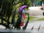 Schoolgirl in the rain, Bayahibe, Dominican Rep..