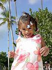 Laugh at the little Dominican wearing a floral dress, Bayahibe, Dominican Rep..