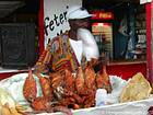 Seller fried and grilled fish, Boca Chica, Dominican Rep..