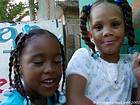 Portrait of little girls with pigtails, Boca Chica, Dominican Rep..