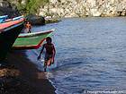 Kid running on the black sand, Boca de Yuma, Dominican Rep..