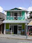 Balcony wooden house painted in shades of green, Boca de Yuma, Dominican Rep..