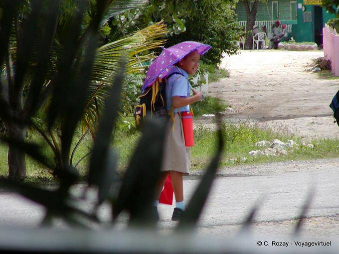 Schoolgirl in the rain, Bayahibe, Dominican Rep.