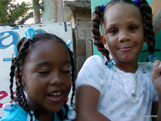 Portrait of little girls with pigtails, Boca Chica, Dominican Rep.