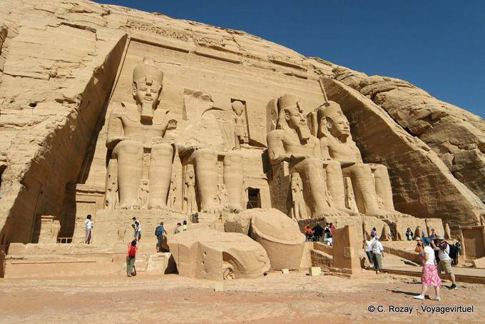 Facade of the Great Temple with the broken head of a statue at the foot, Abu Simbel - Egypt
