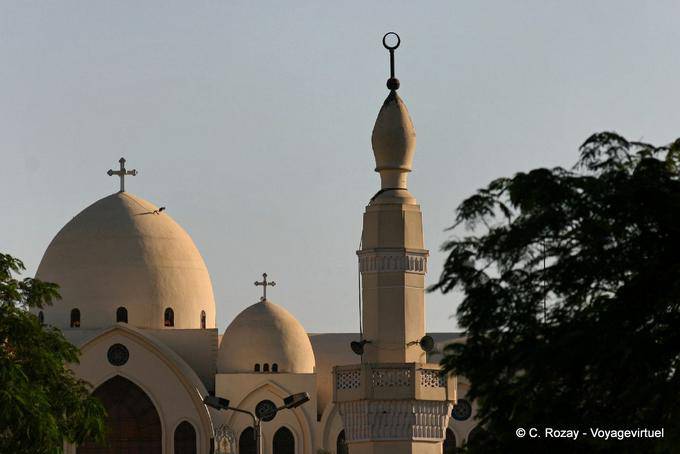 Dome of the Coptic church behind the minaret, Aswan - Egypt