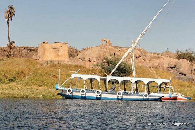 Tourist boat in front of the Temple of Khnum, Abu Elephantine, Aswan - Egypt