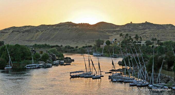 Sunset on the Nile arms and feluccas moored, Aswan - Egypt