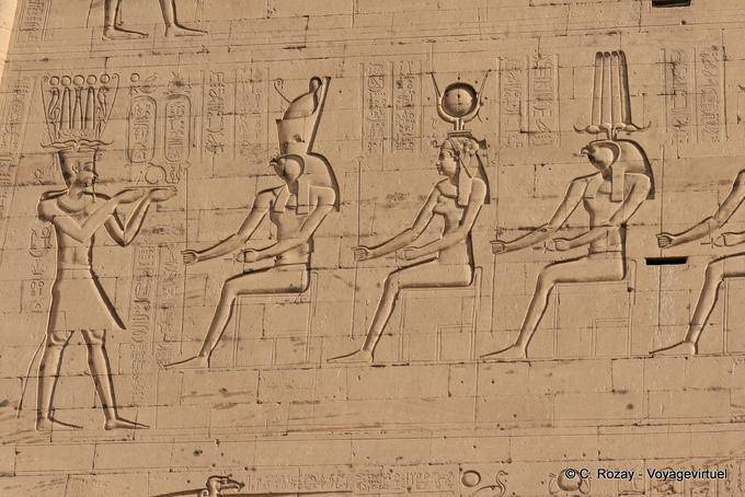 Pharaoh Ptolemy XII making offerings to deities, pylon of Edfu - Egypt