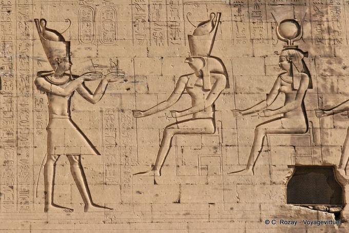 Offering the Pharaoh Ptolemy XII to the gods left the tower, plaza temple, Edfu - Egypt