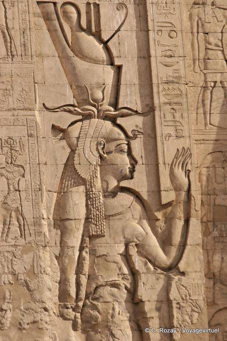Sculpture of the goddess Hathor, wife of Horus, the right of the access door to the temple, Edfu - Egypt