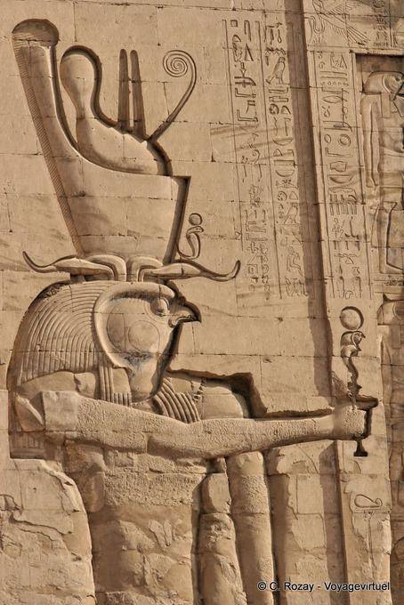 Close the God Horus carved on the facade of the tower, right, Edfu - Egypt
