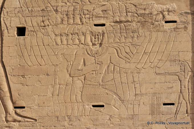 Fragment of the left pylon massif, killing enemies in the presence of Sopdu god, temple of Edfu - Egypt