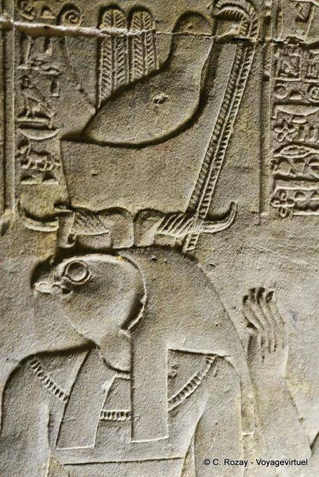 Double crown on the head of Horus Egyptian deity, relief of Edfu - Egypt