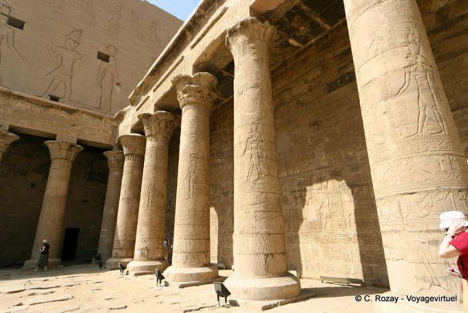 Portico of columns encircling the inside of the front courtyard on three sides, Edfu - Egypt