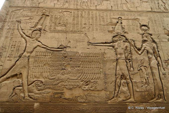 Relief of the god Khnum before Ptolemy into his enemies by the hair, Esna Temple - Egypt